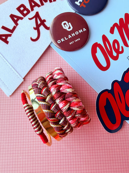 Stacked college bracelets in team colors, game day ready